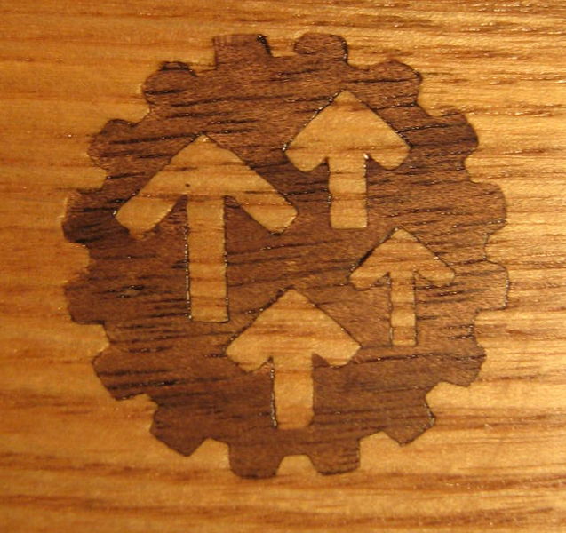 File:Laser cut inlay walnut on oak.JPG